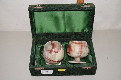 Lot 55 - A pair of polished onyx goblets in case