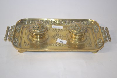 Lot 357 - A brass desk set comprising two ink wells...