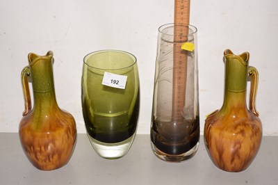 Lot 192 - A pair of treacle glazed jugs together with...