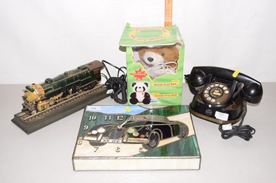 Lot 218 - A locomotive novelty telephone, a teddy bear...