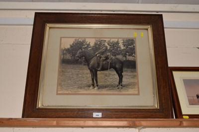 Lot 258 - Military figure on horseback, black and white...