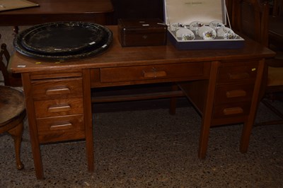 Lot 345 - An oak twin pedestal office desk