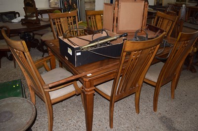 Lot 312 - An oak veneered extending dining table and six...