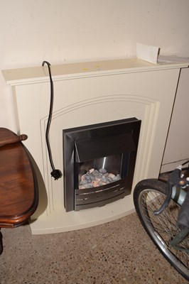 Lot 361 - An electric fire with surround