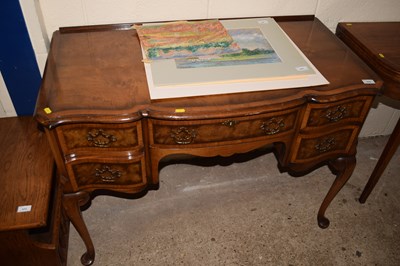 Lot 370 - A reproduction walnut veneered serpentine...