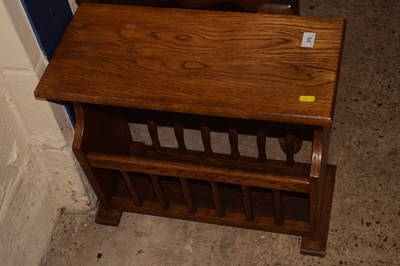 Lot 372 - An oak magazine rack