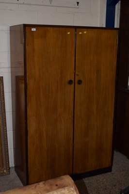 Lot 278 - A vintage two door wardrobe with label for...