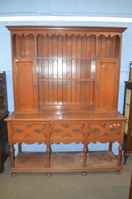 Lot 382 - A large Jacobean Revival oak dresser formed of...
