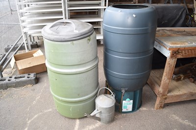 Lot 385 - Two water butts and a galvanised watering can