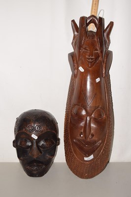 Lot 687 - Two carved African wall hanging masks