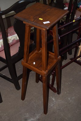 Lot 741 - A stained pine jardiniere stand