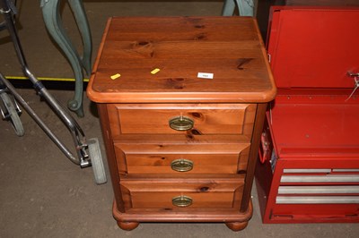 Lot 765 - A stained pine chest of drawers