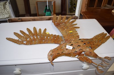 Lot 778 - A metal wall sculpture of a bird of prey