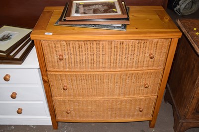 Lot 782 - A pine chest of drawers with wicker fronts and...