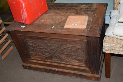 Lot 788 - An oak chest with lift up lid and floral...