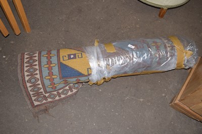 Lot 799 - A hallway runner rug with multi-coloured...