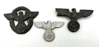 Lot 29 - Three Third Reich shako and hat eagles to...