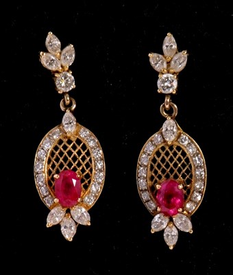 Lot 127 - A pair of ruby and diamond earrings set with...
