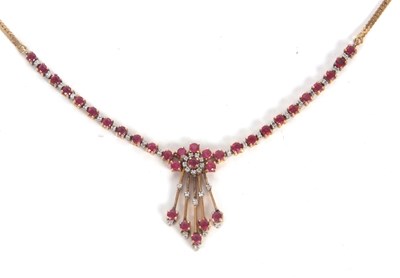 Lot 116 - A ruby and diamond necklace, the central round...