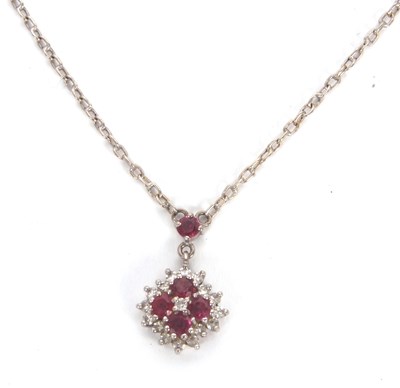 Lot 114 - A ruby and diamond necklace, the pendant set...