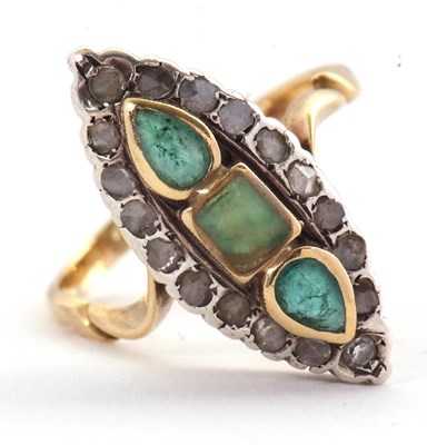 Lot 21 - A marquise shape emerald and diamond ring, set...