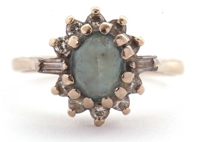 Lot 23 - A blue stone and diamond ring, the pale blue...