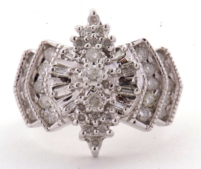 Lot 12 - A 14ct diamond cluster ring, set with round...