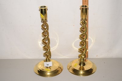 Lot 90 - A pair of brass barley twist candlesticks