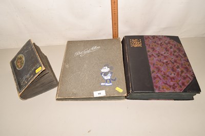 Lot 95 - Three albums of vintage postcards and...