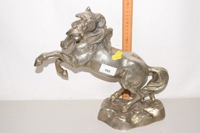 Lot 102 - A silver plated model of a rearing horse