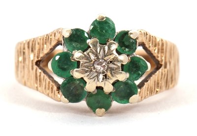Lot 8 - A 9ct emerald and diamond cluster ring, the...