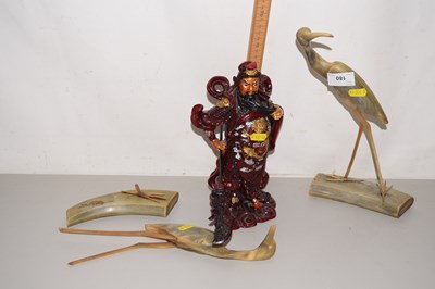 Lot 180 - Two horn model birds and a reproduction resin...