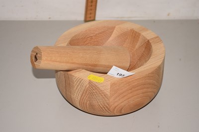 Lot 195 - A wooden pestle and mortar