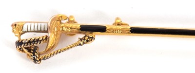 Lot 90 - A 9ct sword brooch, the sword with black...