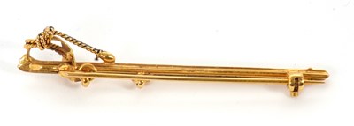 Lot 90 - A 9ct sword brooch, the sword with black...
