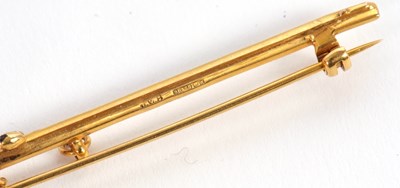 Lot 90 - A 9ct sword brooch, the sword with black...