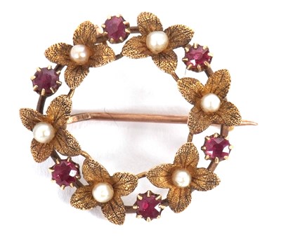 Lot 131 - A 15ct wreath brooch, comprised of flowers...