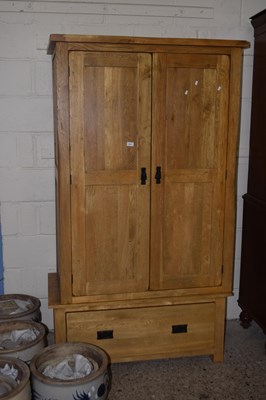 Lot 261 - A modern oak double door wardrobe