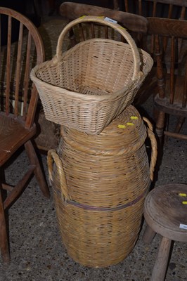 Lot 304 - A wicker basket and a further wicker lidded...