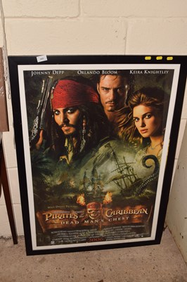 Lot 343 - A framed Pirates of the Caribbean poster