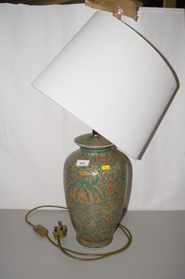 Lot 570 - A green glazed table lamp