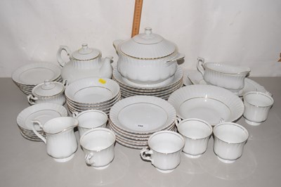 Lot 598 - A white and gilt decorated dinner service