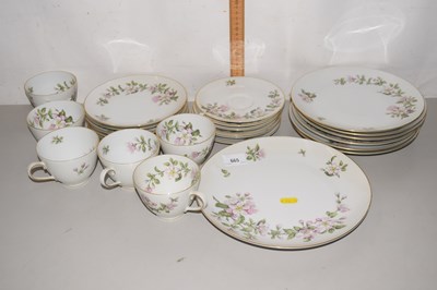 Lot 665 - Quantity of German pink floral decorated...
