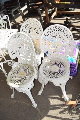 Lot 404 - Three metal cast garden chairs