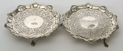 Lot 23 - Two Georgian silver waiters, both having a...