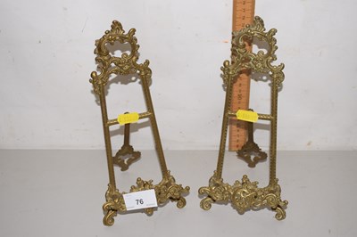 Lot 76 - A pair of small brass easel back picture stands
