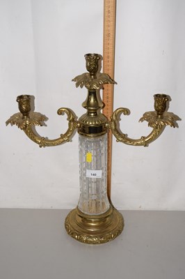 Lot 140 - A brass and glass mounted candelabra