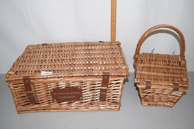 Lot 176 - An Alfred Button wicker picnic hamper and...
