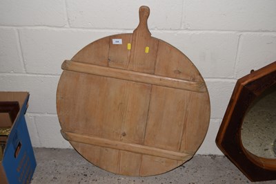 Lot 228 - A large pine circular bread or pizza board