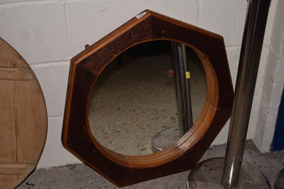 Lot 229 - A modern wall mirror in a hexagonal frame